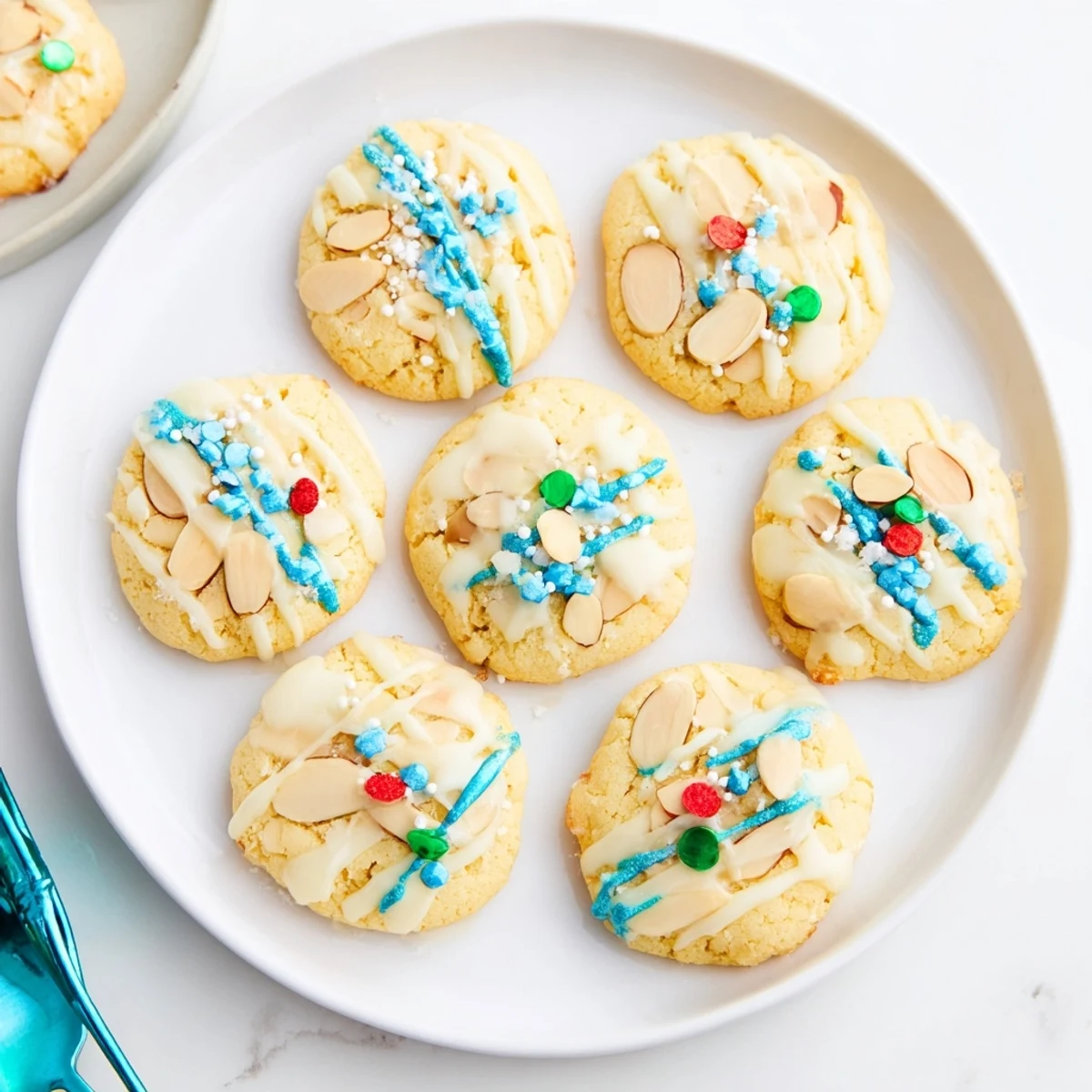 These buttery almond cookies are drizzled with lemon glaze, perfect for holiday gatherings.  