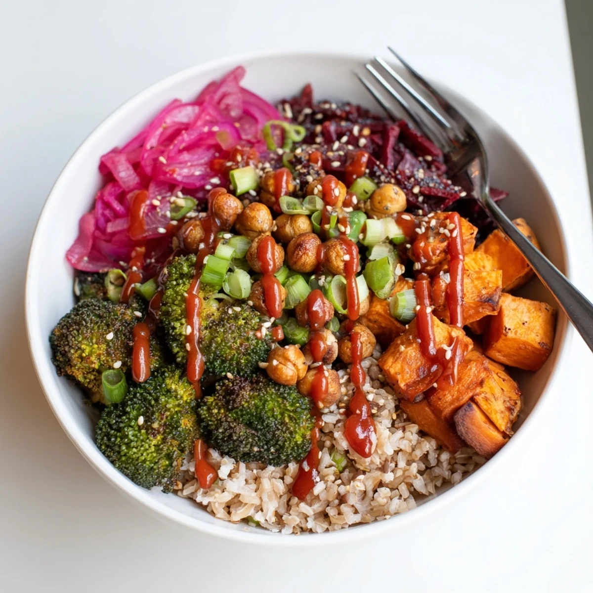 Vibrant Bold Sauce Drizzle Bowls topped with roasted veggies and flavorful sauces.  