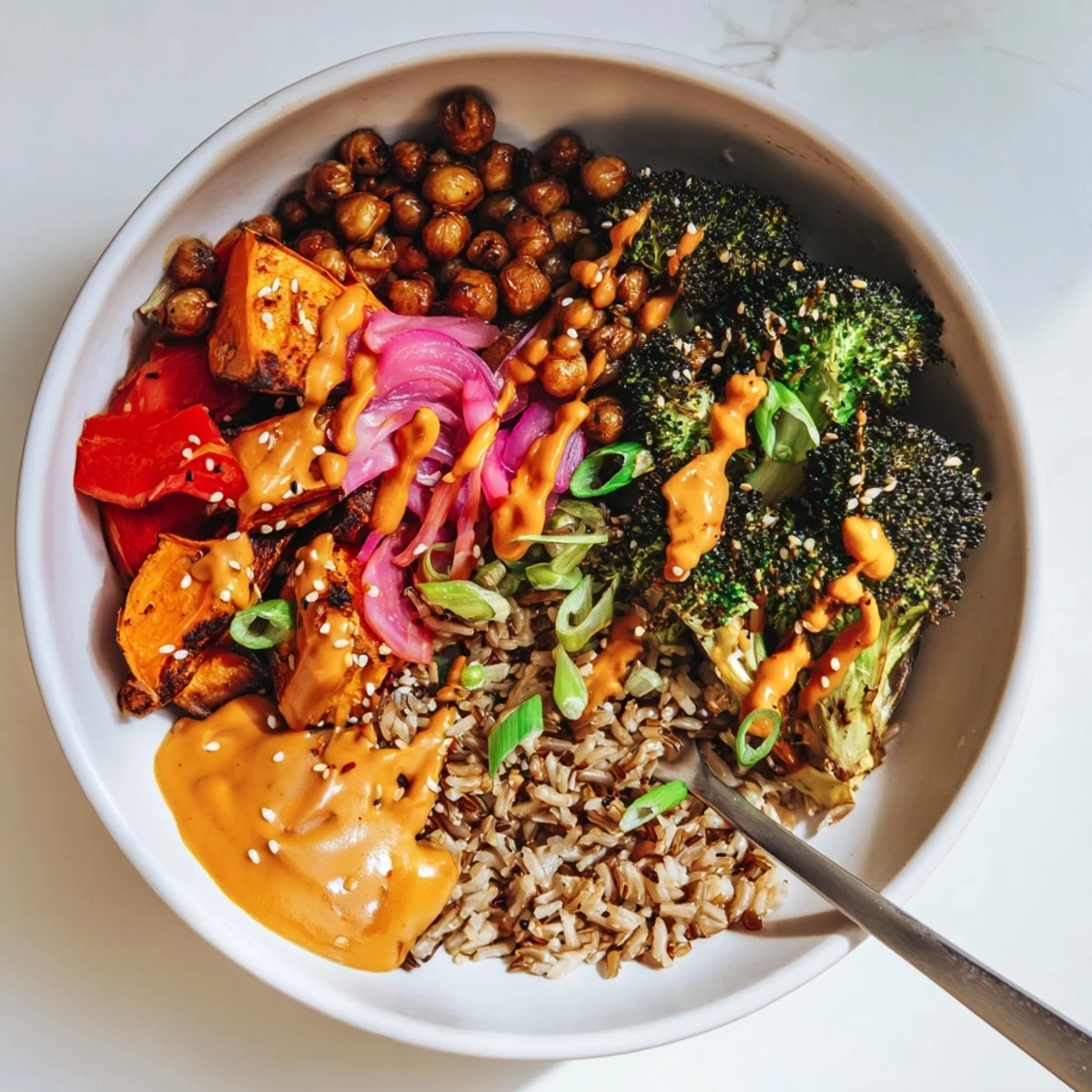 Colorful grain bowls featuring miso-butter and gochujang-maple sauces for delightful flavor.  