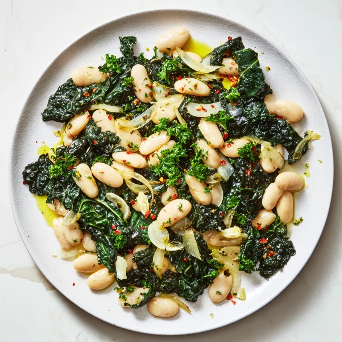 Steaming bowl of Garlicky Beans with Winter Greens, a vibrant, wholesome vegetarian dinner option.