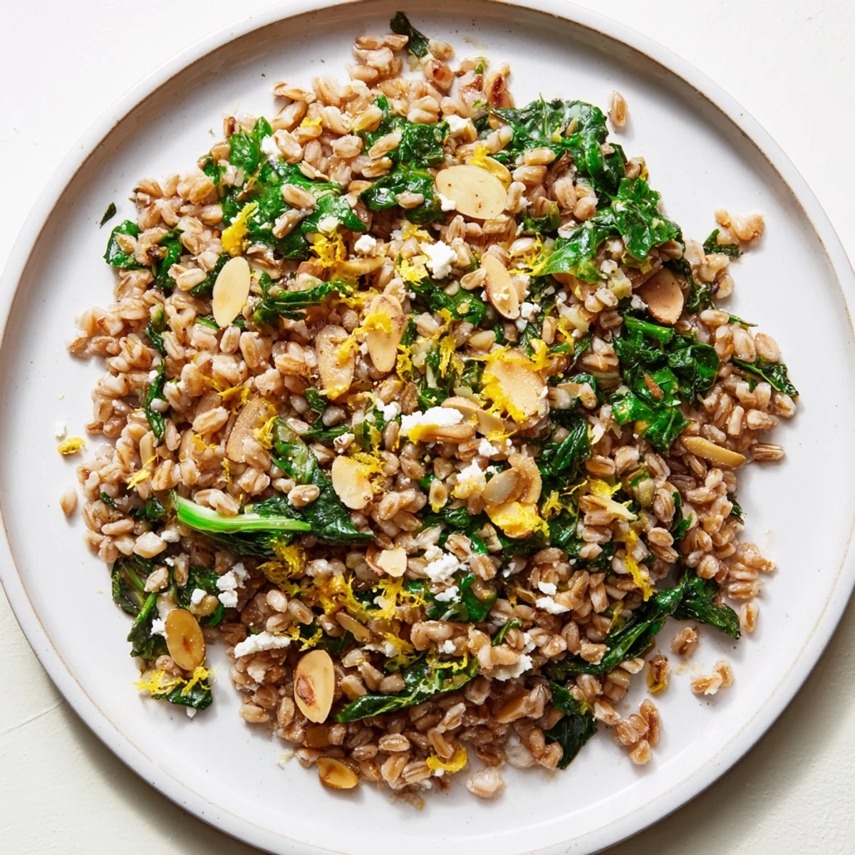 Warm Farro & Greens Pilaf with toasted almonds, a vibrant, wholesome dish perfect for a vegetarian meal.