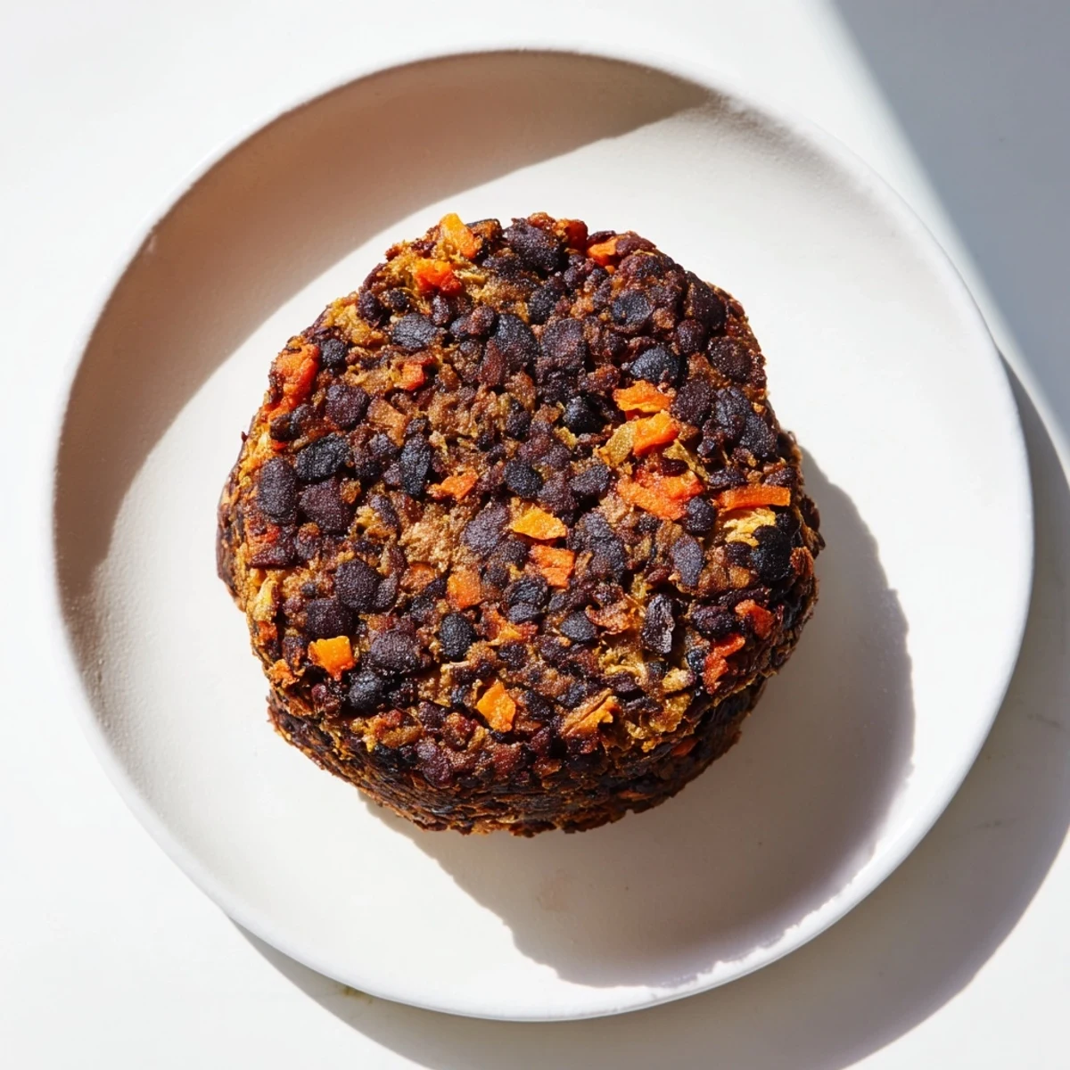 A close-up of a delicious homemade black bean burger, ready to be enjoyed with all the tasty toppings.