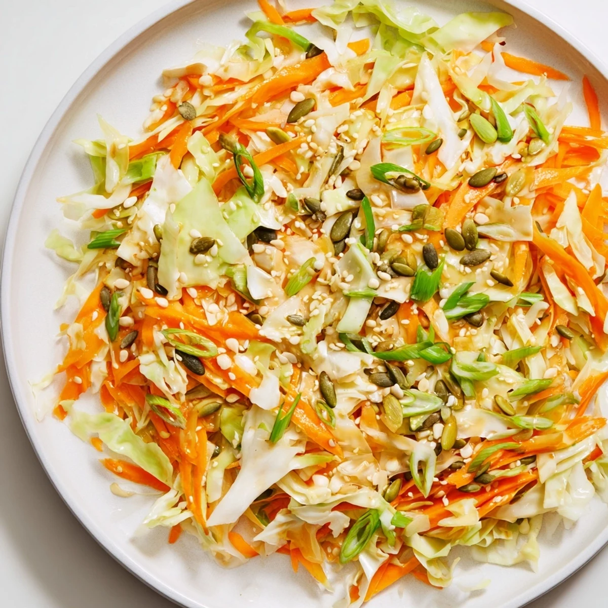 Enjoy this easy Cabbage-Core Slaw Salad; a refreshing vegan and gluten-free side, ready in just minutes.