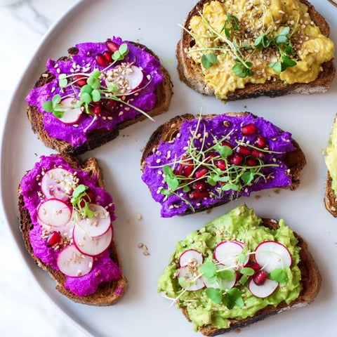 Vibrant Bright & Bold Breakfast Toasts topped with colorful ube and fresh avocado layers.  
