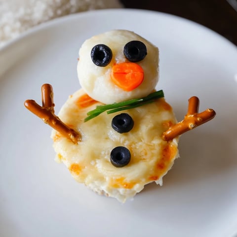 Melted Snowman Cheese Bites are a fun, festive appetizer: creamy snowmen cheese balls perfect for holiday entertaining.