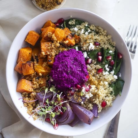 Colorful roasted sweet potatoes and butternut squash in a cozy winter bowl recipe.  