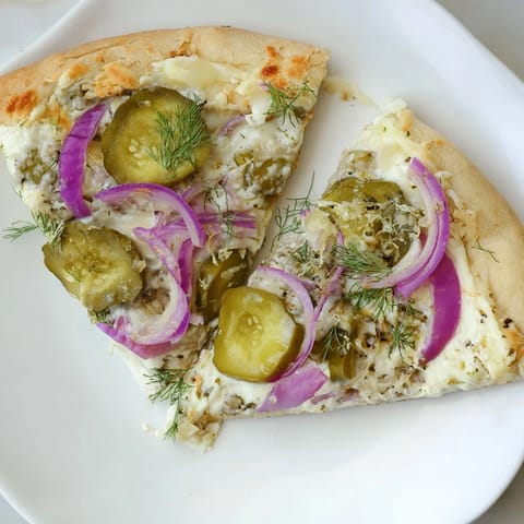 Golden crust topped with tangy sauce, mozzarella, and crunchy dill pickles.  