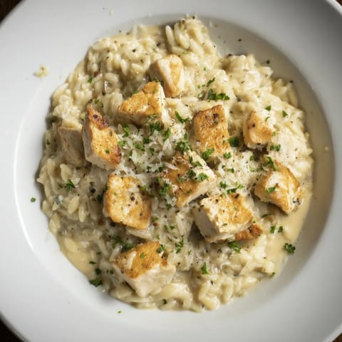 Golden chicken and orzo pasta swim in a rich Cajun Alfredo sauce of the One-Pot dish.