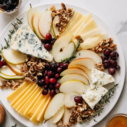 Seasonal Platter: Winter Cabin Cheese Display, a beautifully arranged appetizer board with cheeses and fruits.
