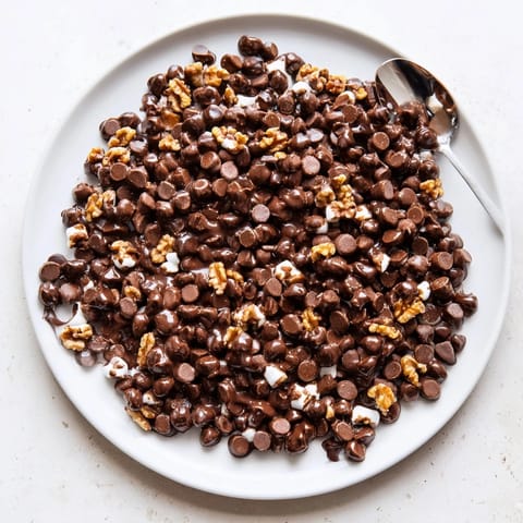 See the melted chocolate chips clinging to puffy marshmallows in this quick, easy dessert.