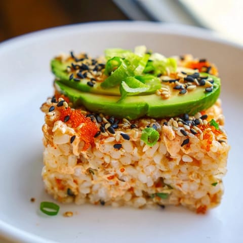 Close-up of freshly served spicy tuna crispy rice, perfect appetizer for gatherings.
