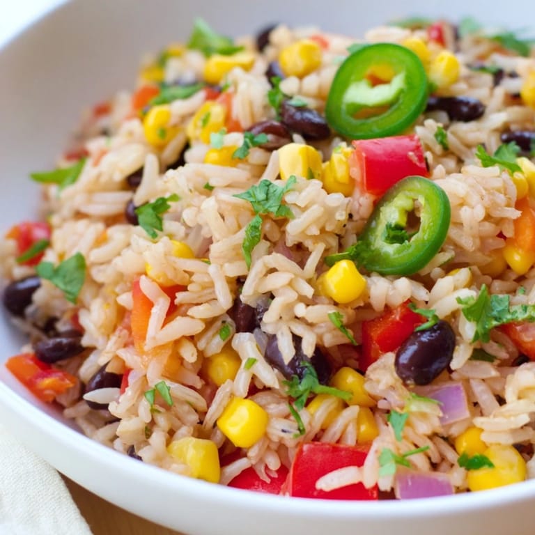 Colorful One-Pot Mexican Rice & Beans, featuring fluffy rice, beans, and vegetables—perfect for dinner.