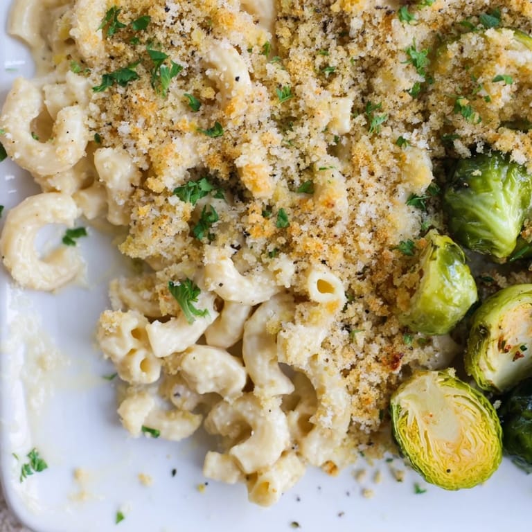 Oven-baked Sheet Pan Mac and Cheese with Brussels Sprouts offers cheesy, comforting macaroni with roasted sprouts.