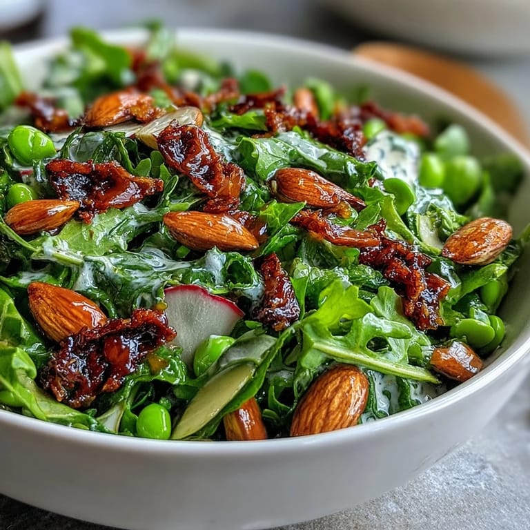 Crisp mixed greens tossed in tangy honey mustard vinaigrette, accented with snap peas, radishes, and golden toasted almonds.